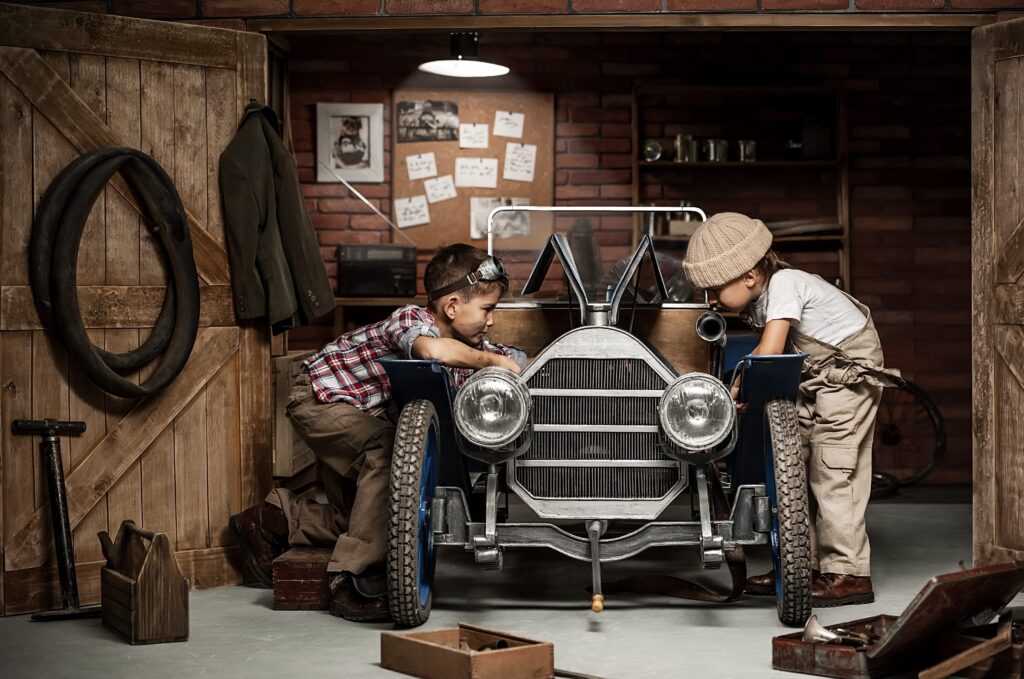 Garage Two boys fixing car